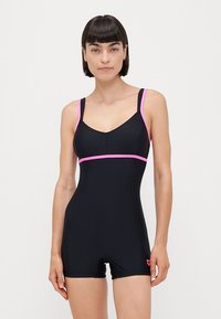 Maillot de bain une pièce noir avec des accents roses, doté de bretelles réglables, d'un décolleté arrondi et d'un design ajusté. Texture lisse.