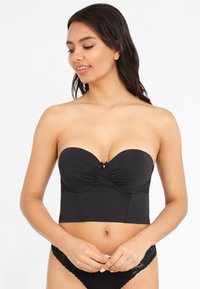 Black strapless bra with lace detailing, padded cups, and a central accent. Smooth, fitted design extending to the waist.