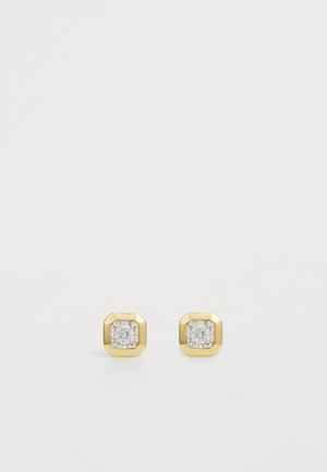 Brincos de studs octogonais em tom de ouro com pedras centrais de zircônia cúbica, criando um design minimalista e geométrico.