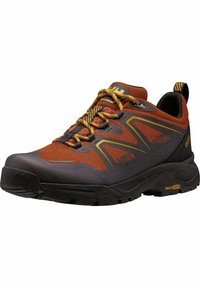 Zapatillas de trail con una parte superior de malla negra y naranja, acentos texturizados y cordones amarillos. Presenta una suela de goma robusta para mayor tracción.