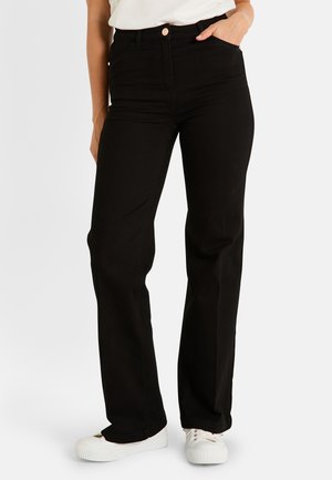 WOODSTOCK - Vaqueros bootcut - noir