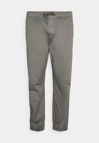 Pantaloni din bumbac gri, cu talie elastică, închidere cu șnur și manșete conice. Textură netedă și design minimalist.