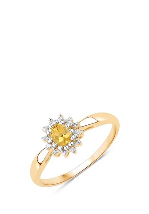 Goldener Ring mit einem zentralen gelben Edelstein, umgeben von kleinen weißen Diamanten in einer floralen Clusterfassung.