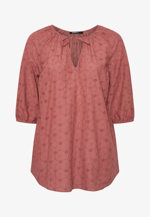 Tunique rose à manches trois-quarts, avec un décolleté en trou de serrure et des motifs floraux brodés sur l'ensemble. Tissu doux et texturé.