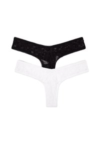 Perizoma in pizzo bianco e nero. Il nero presenta un motivo floreale; il bianco vanta una texture simile. Entrambi hanno fasce sottili e bordi morbidi.