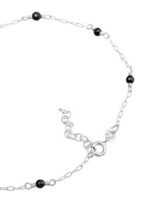 Silver chain necklace featuring black gemstone beads, oval links, and a lobster clasp. The chain includes a 925 sterling silver tag.