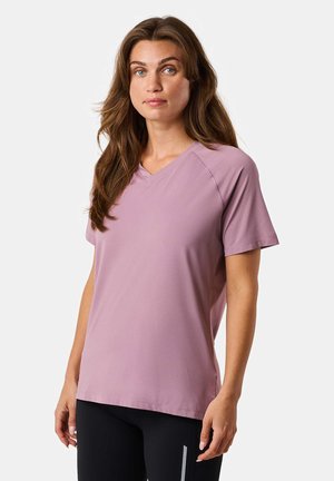 Light purple athletic t-shirt with a v-neck, short sleeves, and a breathable texture. Features raglan sleeves for ease of movement.