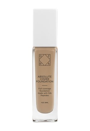 Butelka podkładu OFRA Absolute Cover z białą nakrętką, beżowa formuła całkowitego krycia oraz tekst informujący o peptydach jedwabiu i pojemności 30 ml.