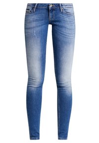 Vaqueros pitillo en denim azul descolorido, con un diseño clásico de cinco bolsillos, sutiles efectos de desgaste en el tejido y cremallera con cierre de botón.