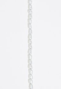 String of irregularly shaped white pearls with a glossy finish, displaying varied sizes and subtle luster on a white background.