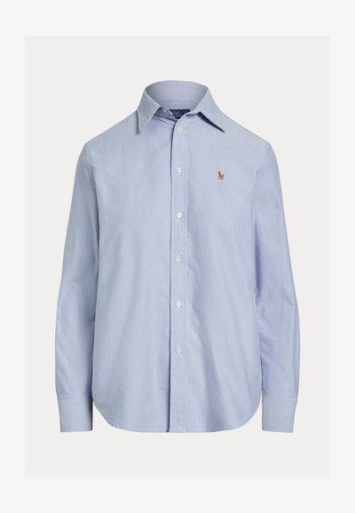 Light blue long-sleeve button-up shirt with a pointed collar and small embroidered logo on the left chest.