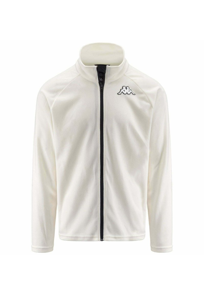 Giacca di fleece bianca con colletto alto, zip frontale e logo nero sul lato sinistro del petto. Presenta maniche raglan e una texture liscia.