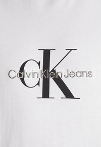 Calvin Klein Jeans MONOLOGO TEE UNISEX - Camiseta estampada - bright white