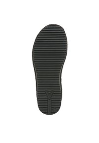 Black rubber shoe sole with horizontal ridges for traction, featuring a central logo and smooth edges.