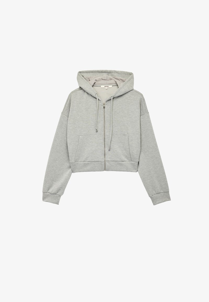 Grå cropped hoodie lavet af blødt stof. Har en frontlynlås, snor i hætten og sidelommer. Ribbet ved håndled og i kanten.
