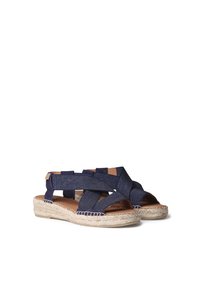 Sandalias de esparto azul marino con parte superior de textil trenzado, punta abierta y suela de yute. Presentan tiras cruzadas para mayor sujeción y comodidad del pie.