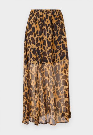 Jupe en imprimé léopard en tissu léger et transparent. Dotée d'une taille élastique et d'un design fluide, avec des nuances de marron et des taches noires.