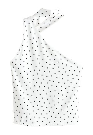 White sleeveless top with black polka dots, featuring an asymmetrical neckline with a halter-style strap.