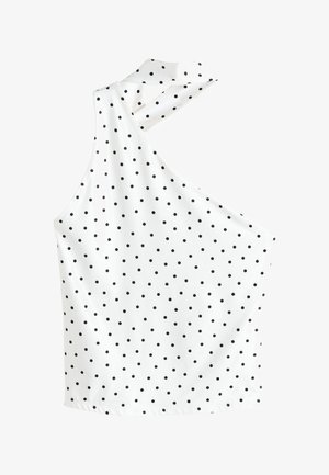 White sleeveless top with black polka dots, featuring an asymmetrical neckline with a halter-style strap.