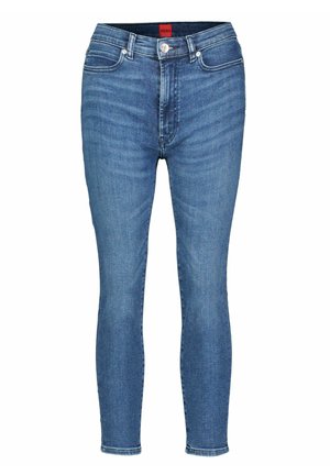 Skinny jeans made of medium-wash denim, featuring a classic five-pocket design, stitched seams, and a subtle fade effect.