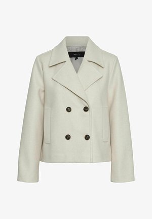 Beige dubbelzijdig jasje met een gekartelde revers, gemaakt van zachte stof, met twee zijzakken en donkere knopen als accenten.