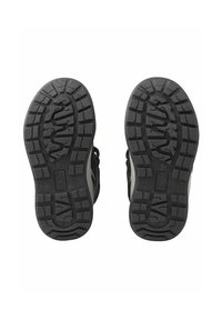 Scarpe da esterno nere con suole in gomma, caratterizzate da un motivo di grip testurizzato e una parte superiore di colore neutro. Progettate per garantire aderenza e durata.