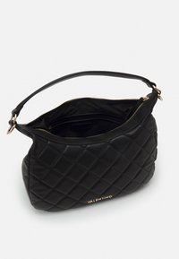 Black leather handbag with quilted pattern, gold hardware, and a single shoulder strap. Zipper closure reveals a black fabric interior.