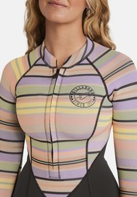 Multicolored long-sleeve rash guard featuring horizontal stripes in pastel shades, black stitching, and a round logo on the chest.