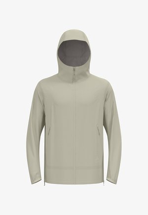 Giacca beige chiaro con cappuccio, chiusura con zip frontale e due tasche laterali. Tessuto morbido, design aderente e polsini elastici.