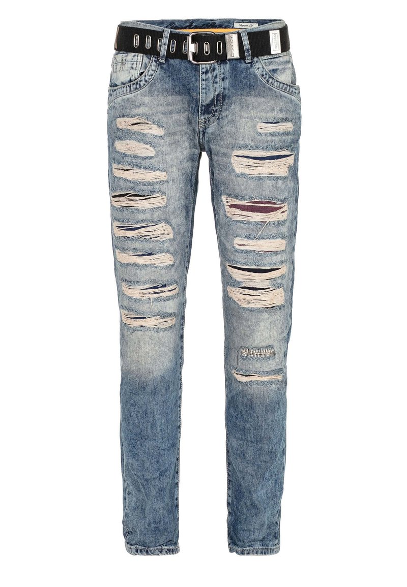 Blue denim jeans with a slim fit, featuring multiple distressed rips, a black belt with silver hardware, and a faded design.