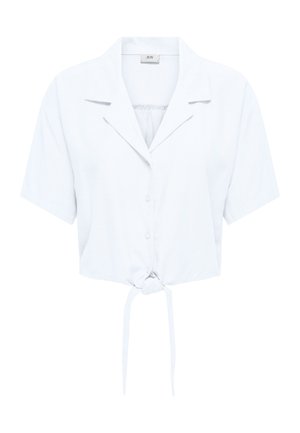 Camicia bianca a maniche corte con bottoni, colletto e nodo frontale, mostrata su uno sfondo bianco semplice.