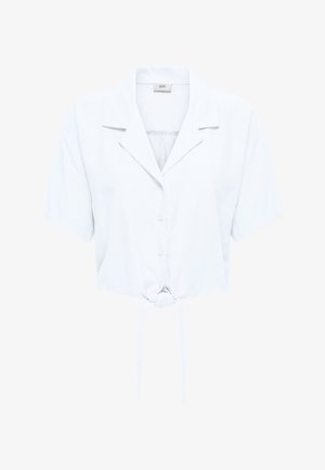 Camicia bianca a maniche corte con bottoni, colletto e nodo frontale, mostrata su uno sfondo bianco semplice.