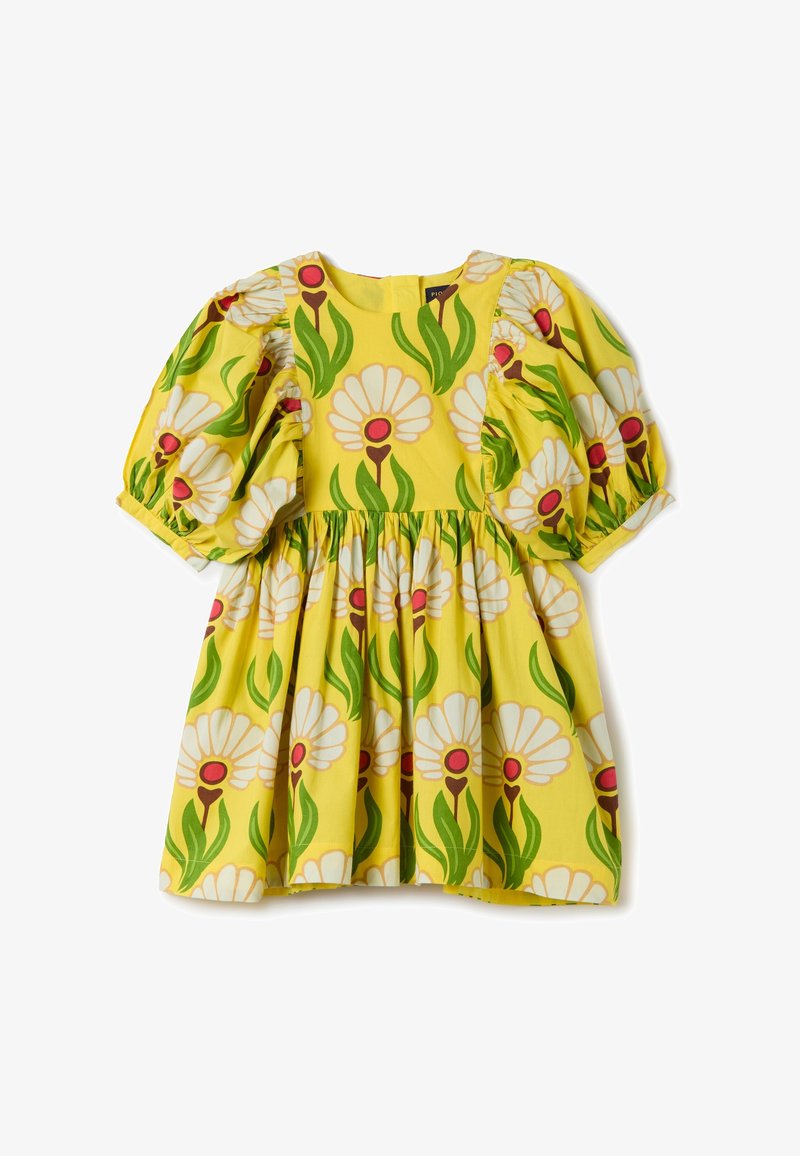 Vestido floral amarillo con mangas abullonadas, un cuerpo fruncido, grandes margaritas blancas con centros rojos y acentos de hojas verdes. Material de algodón.