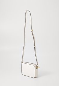 White leather crossbody bag with a rectangular shape, gray leather strap, gold hardware accents, and black edge stitching.
