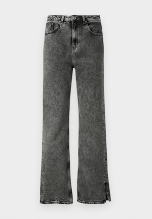 Black flared jeans with a faded wash, high waist, and side slits at the hem. Made of denim with a smooth texture and classic five-pocket design.