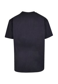 Black short-sleeve t-shirt with a round neck, made of cotton, featuring a smooth texture and straight cut hem. Rear view shown.