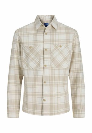Chemise à manches longues en tartan beige et blanc avec deux poches poitrine, chacune fermée par un bouton.