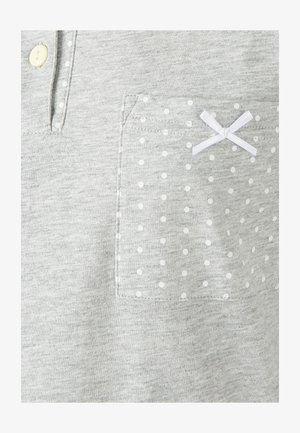 Gray cotton shirt with a buttoned placket, featuring a polka-dotted pocket and a white bow accent. Soft texture and casual design.