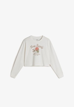 Valkoinen lyhythihainen paita pitkällä hihalla, jossa on pinkki ja vihreä kukkakuva, ja jossa on vintage-tyylinen "Vans Supply" -teksti sekä pehmeä, sileä pinta.