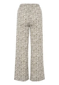 Lichte, crème gekleurde broek met een bruin abstract patroon, voorzien van een relaxte pasvorm en een elastische tailleband voor comfort.