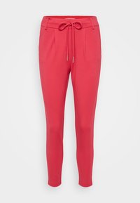 Pantalon slim rose vif avec poches avant, passants de ceinture et taille avec cordon noué en nœud, présenté sur fond blanc.