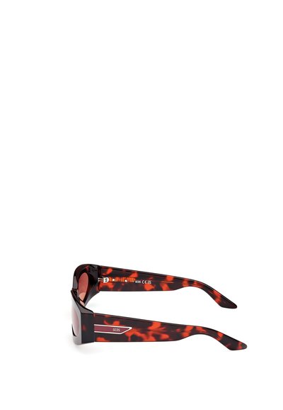 Tortoise-shell sunglasses with dark lenses. Durable plastic construction, thick temples, and subtle branding on the arms.