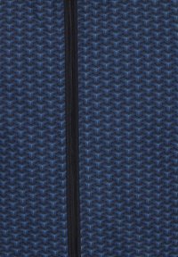 Navy blue patterned fabric with a geometric design. Features a visible black zipper running vertically along the middle. Textured surface.