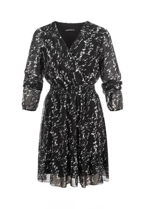 Abito nero fino al ginocchio con motivo floreale bianco, scollo a V, maniche lunghe trasparenti, vita elasticizzata e gonna fluida con orlo arricciato.