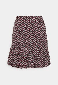 Jupe à motif floral rouge et blanc sur fond noir, avec un ourlet évasé et un tissu texturé à motif chevron.