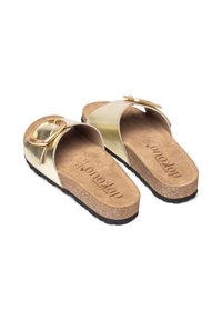 Gold slide sandals with a cork footbed, textured metallic upper, and a decorative buckle. Features a rubber outsole for traction.