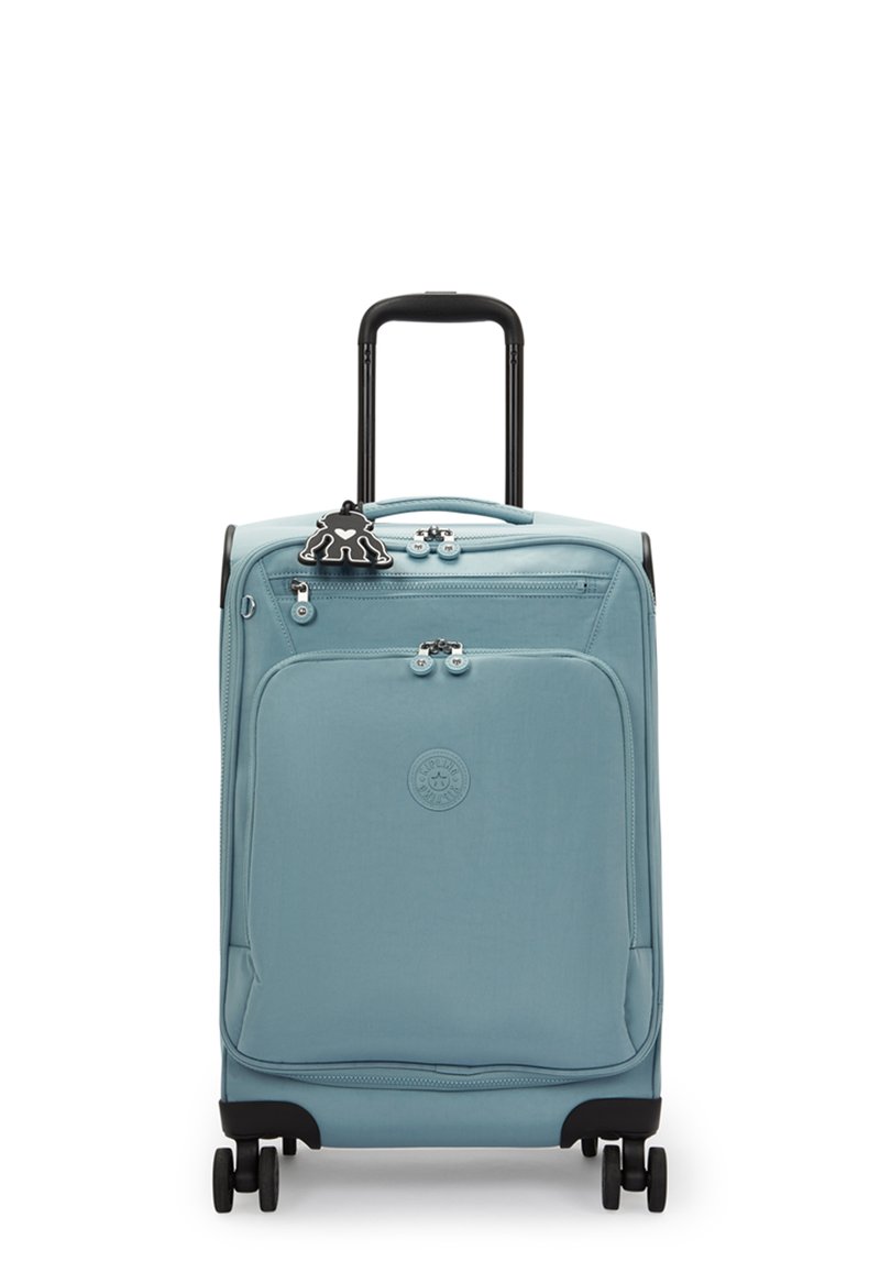 Blue soft-sided suitcase with a black retractable handle, four wheels, and a front pocket. Features a decorative black tag.