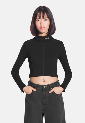 - Bluzka z długim rękawem