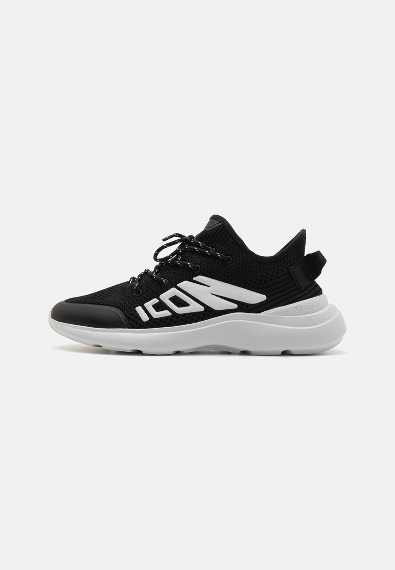 Black mesh sneaker with a textured finish, white branding, and a padded collar. Features a chunky white sole and black laces.