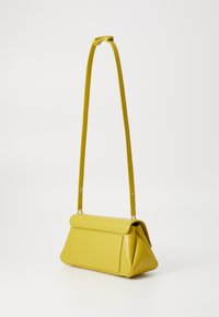 Yellow leather shoulder bag with a structured, triangular design, a front flap, and a long, adjustable strap. Smooth texture with visible seams.